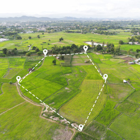 Land plot in aerial view, Top view land green field agriculture plant with pins, pin location icon for housing subdivision residential development owned sale rent buy or investment countryside suburbs